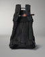 Black backpack with orange buckle on a gray background