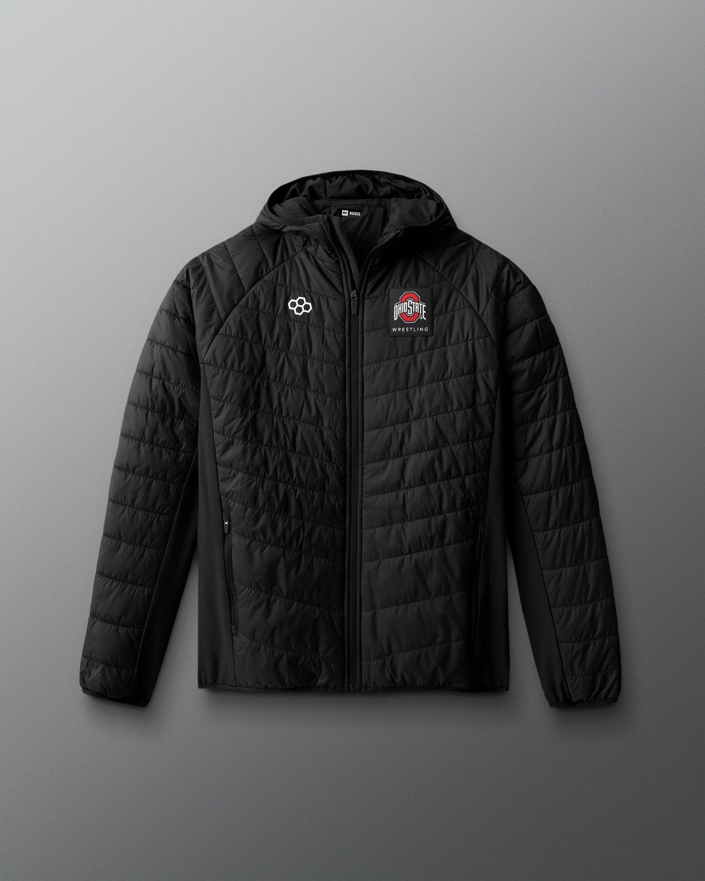 Black quilted jacket with logos on a gray background