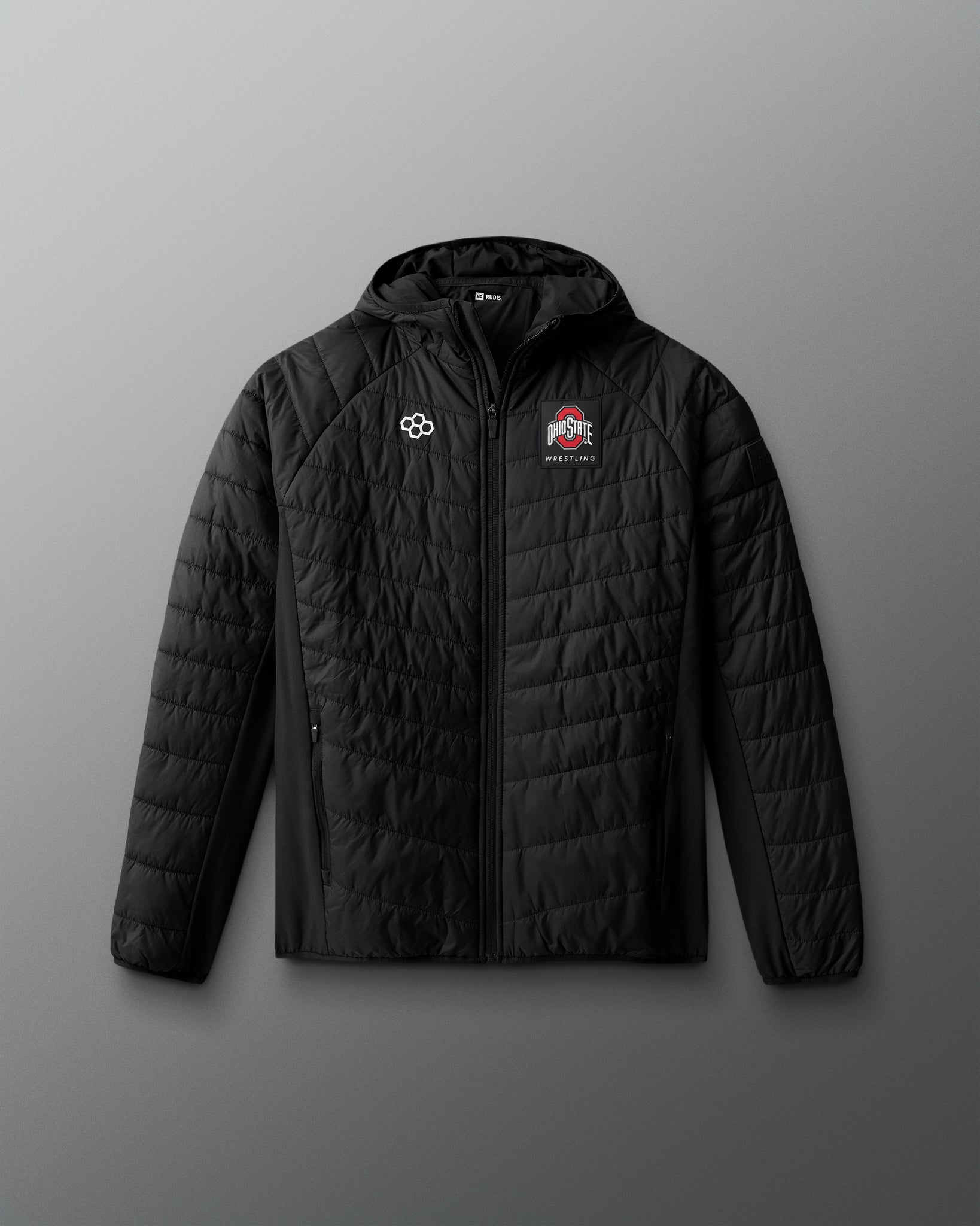 Black quilted jacket with logos on a gray background
