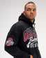 Close-up of the RUDIS Ohio State Buckeyes black fleece hoodie on a model, highlighting the Ohio State sleeve logo, Buckeyes Wrestling chest graphic and relaxed fit.