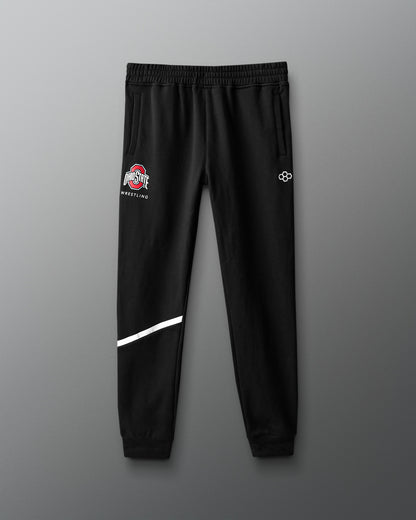 Black sweatpants with logos on a gray background