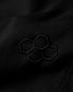 Close-up of a black fabric with embroidered hexagonal pattern