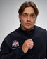 Man wearing a black jacket with Ohio State Wrestling logo on a gray background