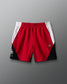 Red and black athletic shorts with white accents on a gray background