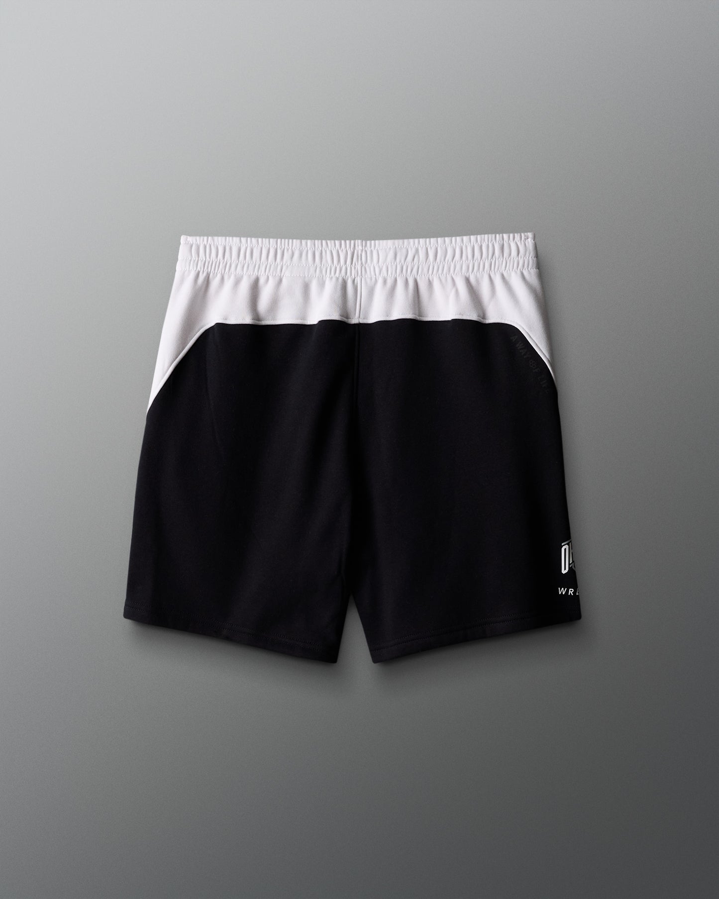 Black and white shorts on a gray background