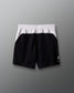 Black and white shorts on a gray background