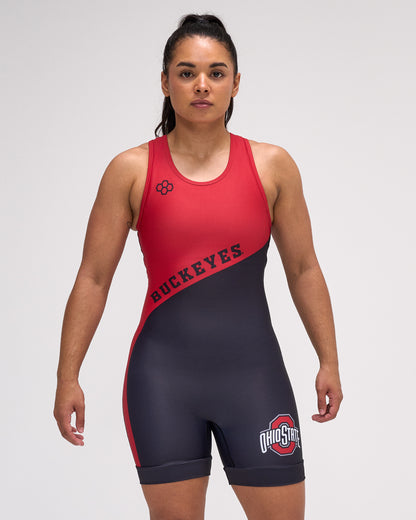Person wearing a red and black wrestling singlet on a white background