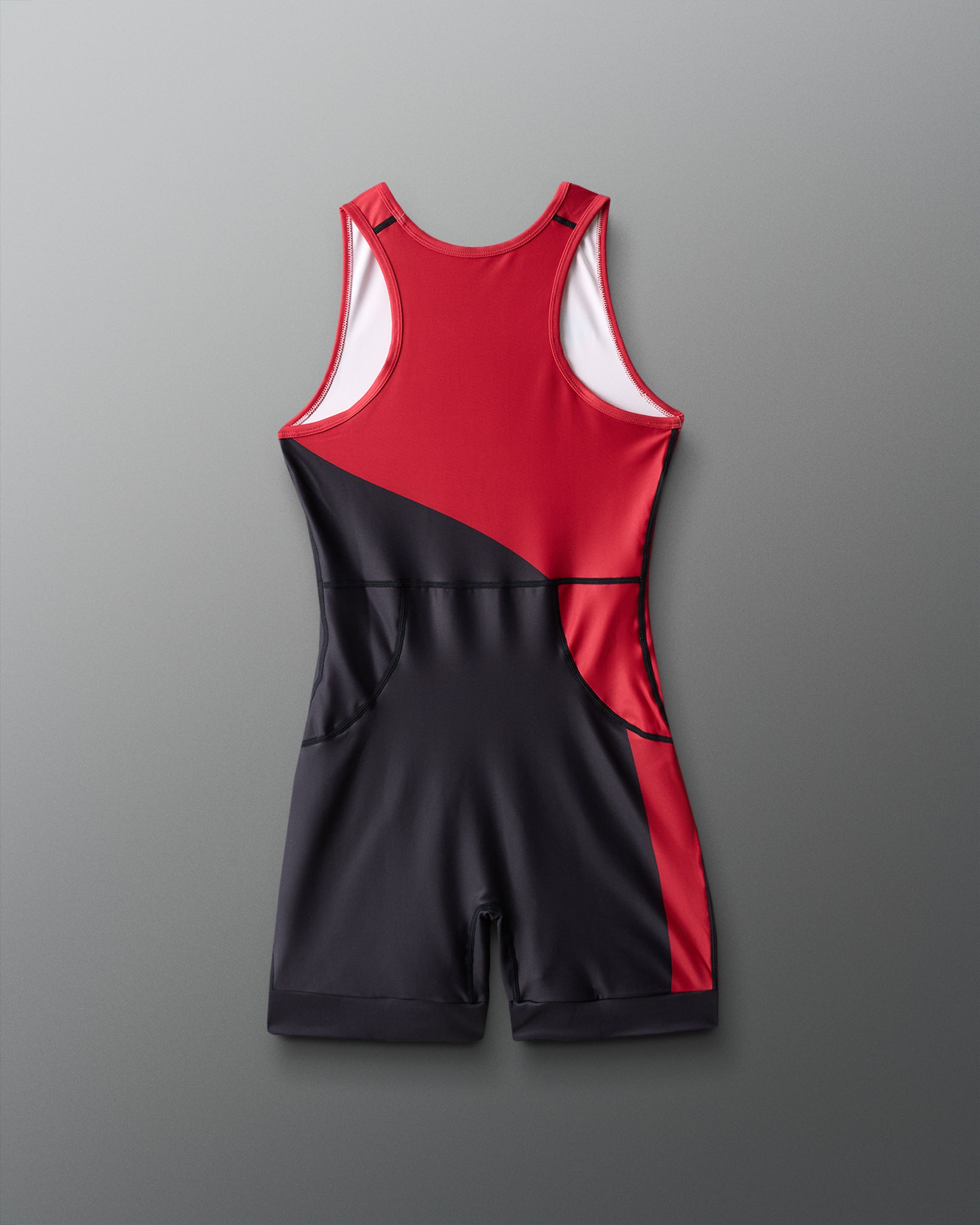 Red and black wrestling singlet on a gray background