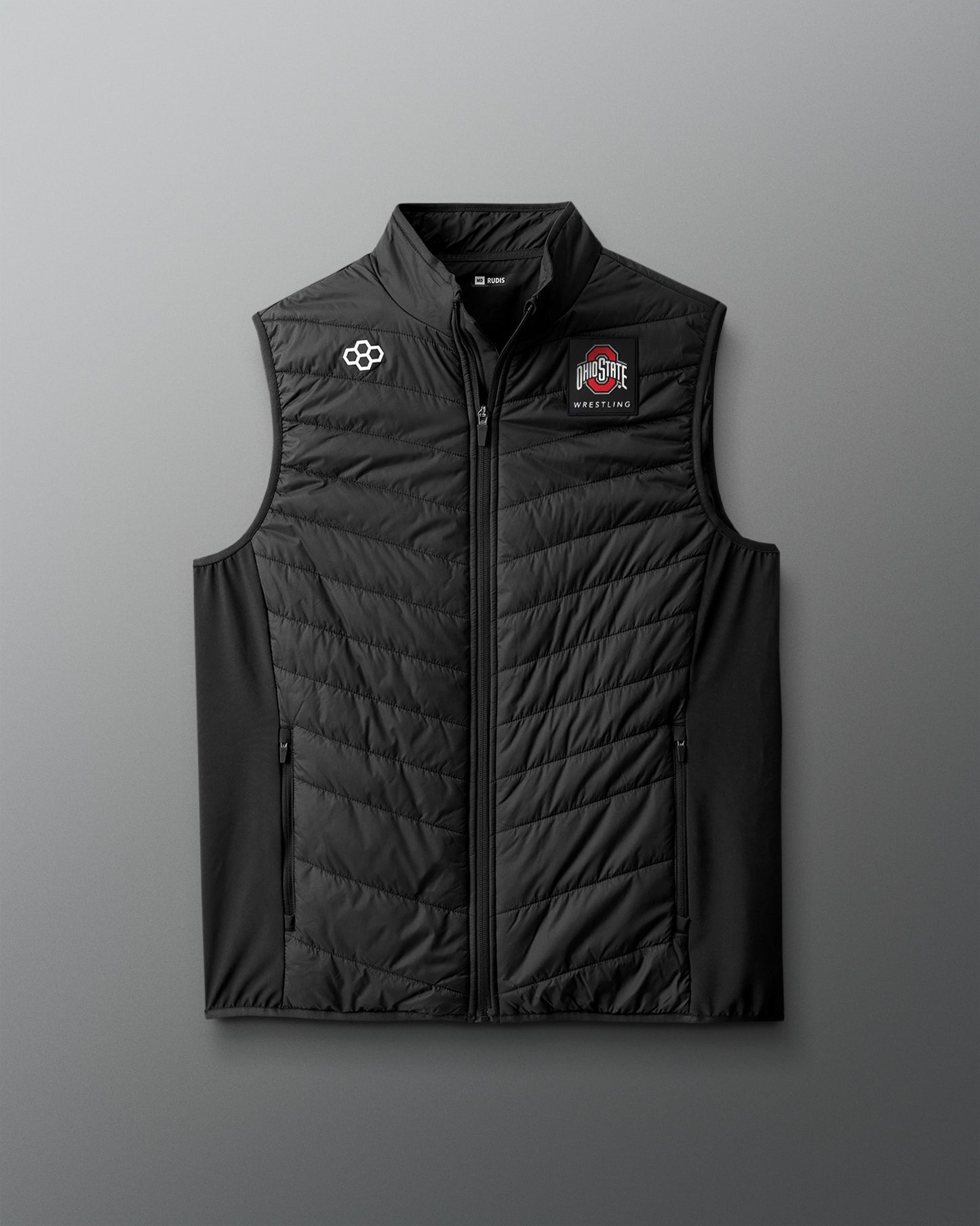 Black puffer vest with logos on a gray background