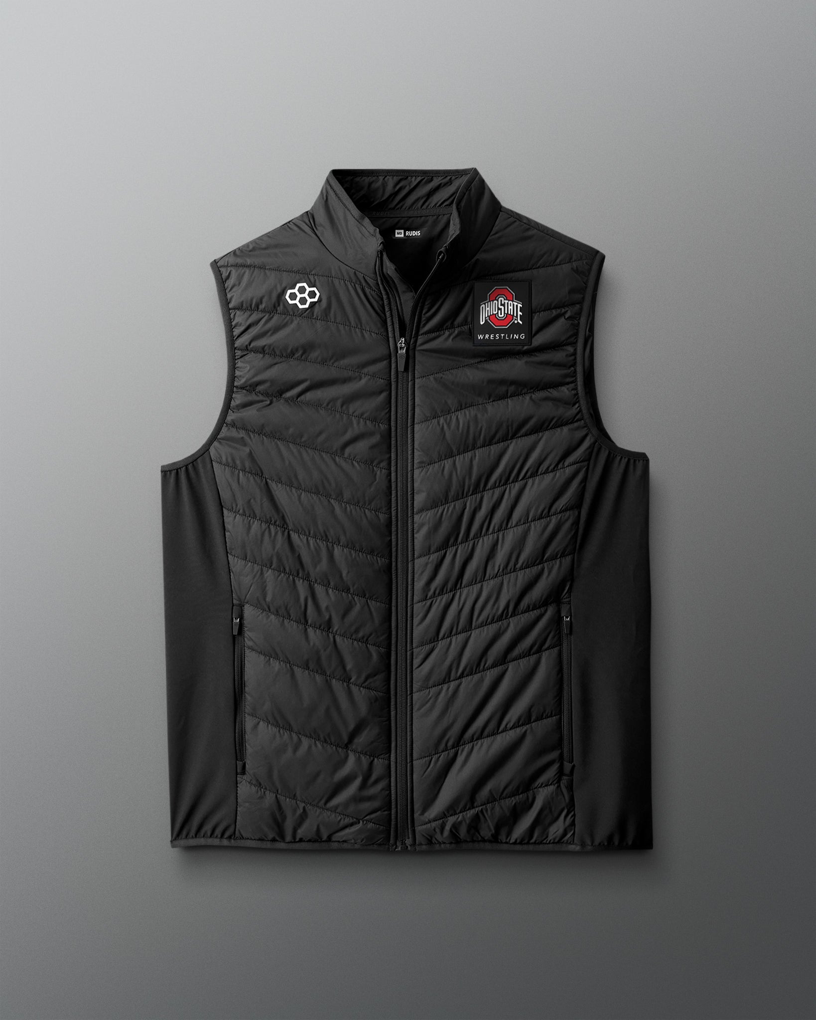 Black puffer vest with logos on a gray background