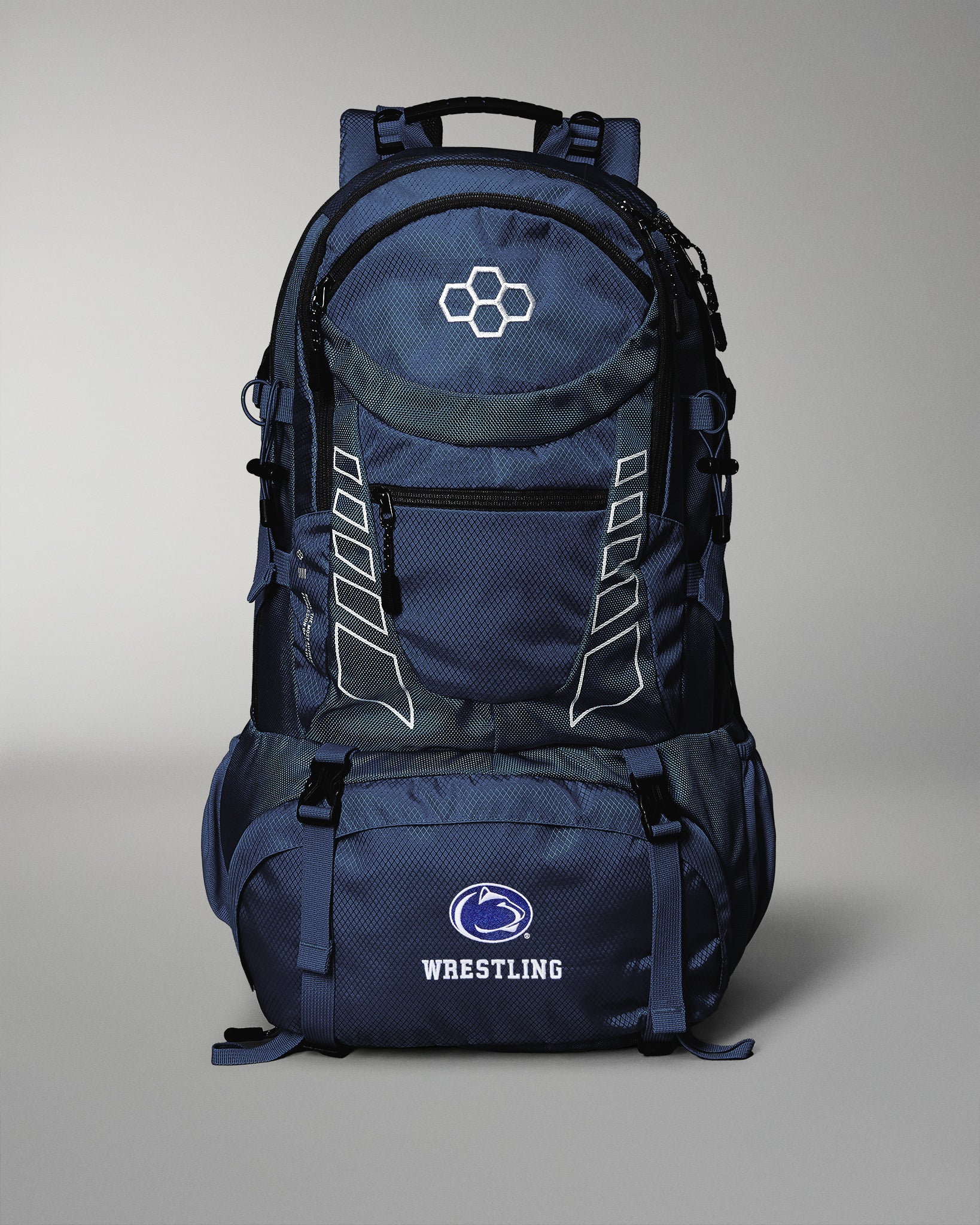 Navy blue backpack with wrestling logo on a gray background