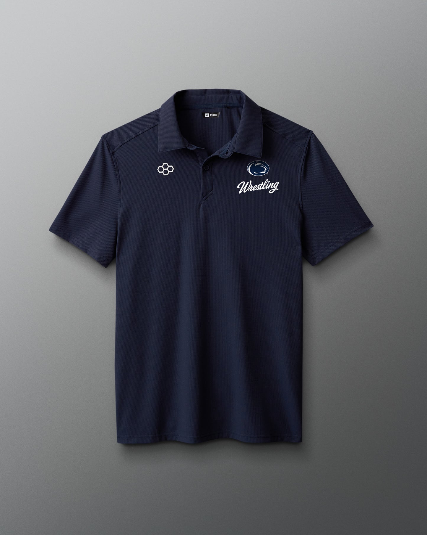 Navy blue polo shirt with logos on a gray background