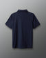 Navy blue polo shirt on a gray background