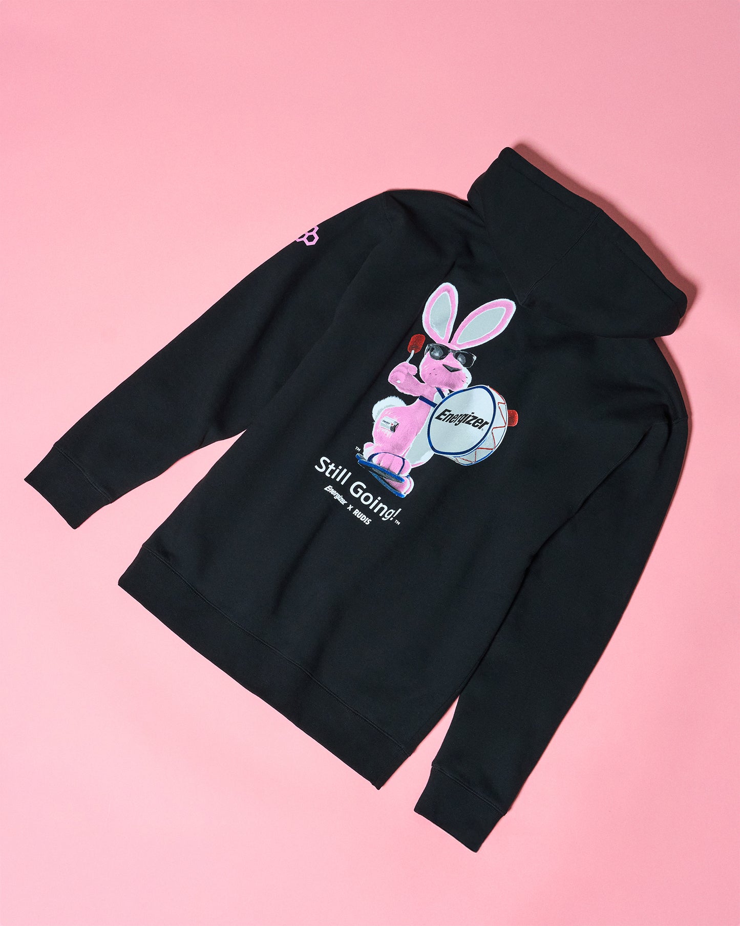 Black hoodie with the energizer bunny on a pink background