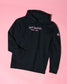 Black hoodie with 'Still Going!' text on a pink background