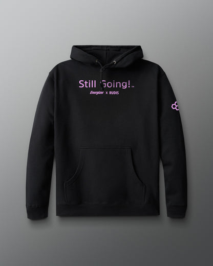 Black hoodie with 'Still Going!' text on a gray background
