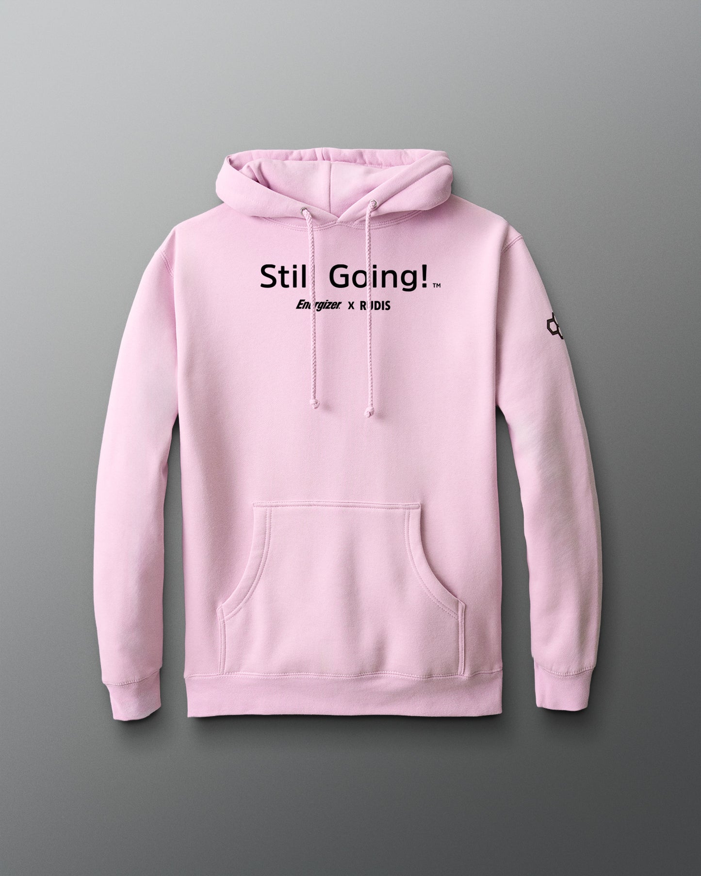 Pink hoodie with 'Still Going!' text on a gray background