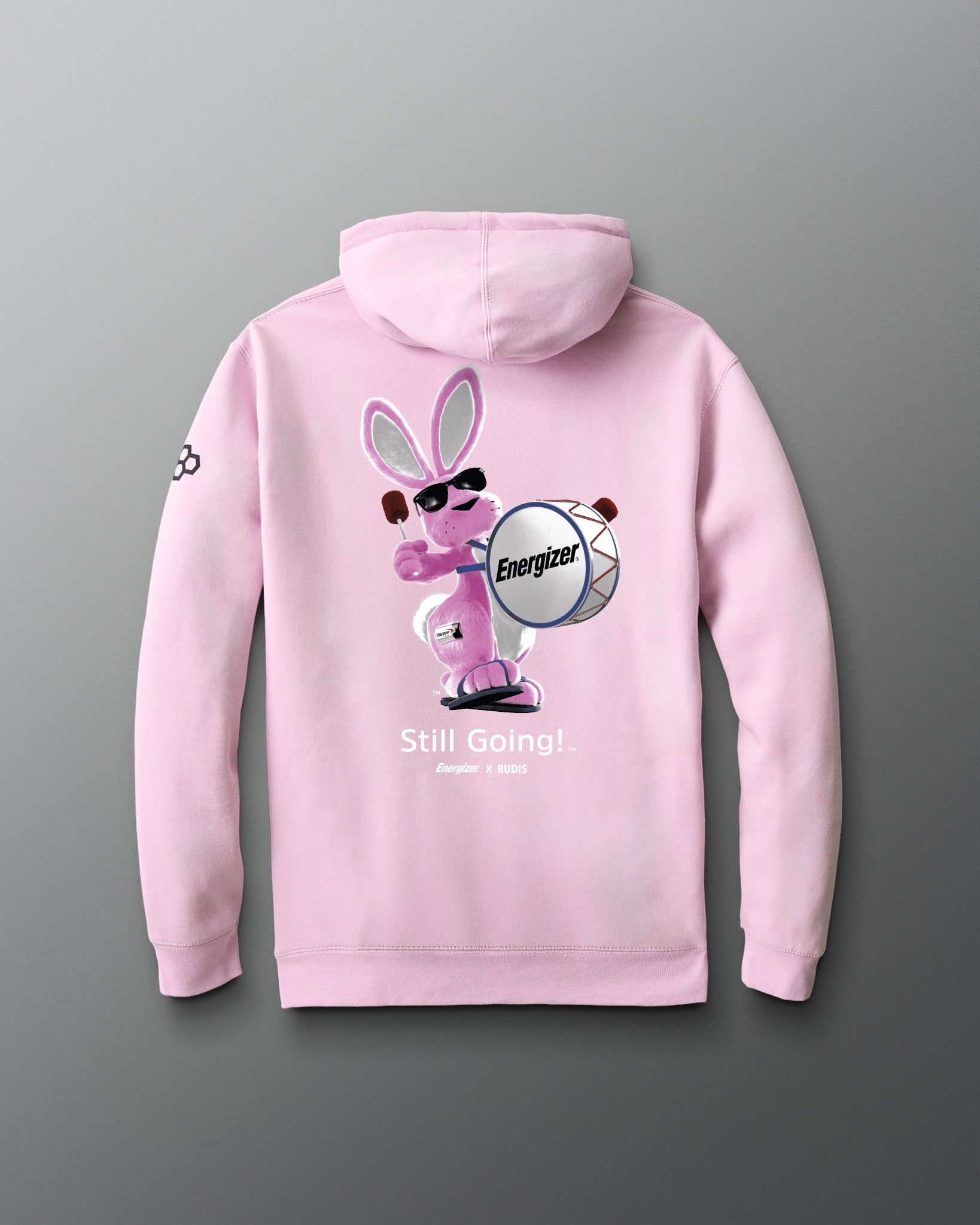 Pink hoodie with a graphic of a bunny holding an Energizer battery on a gray background