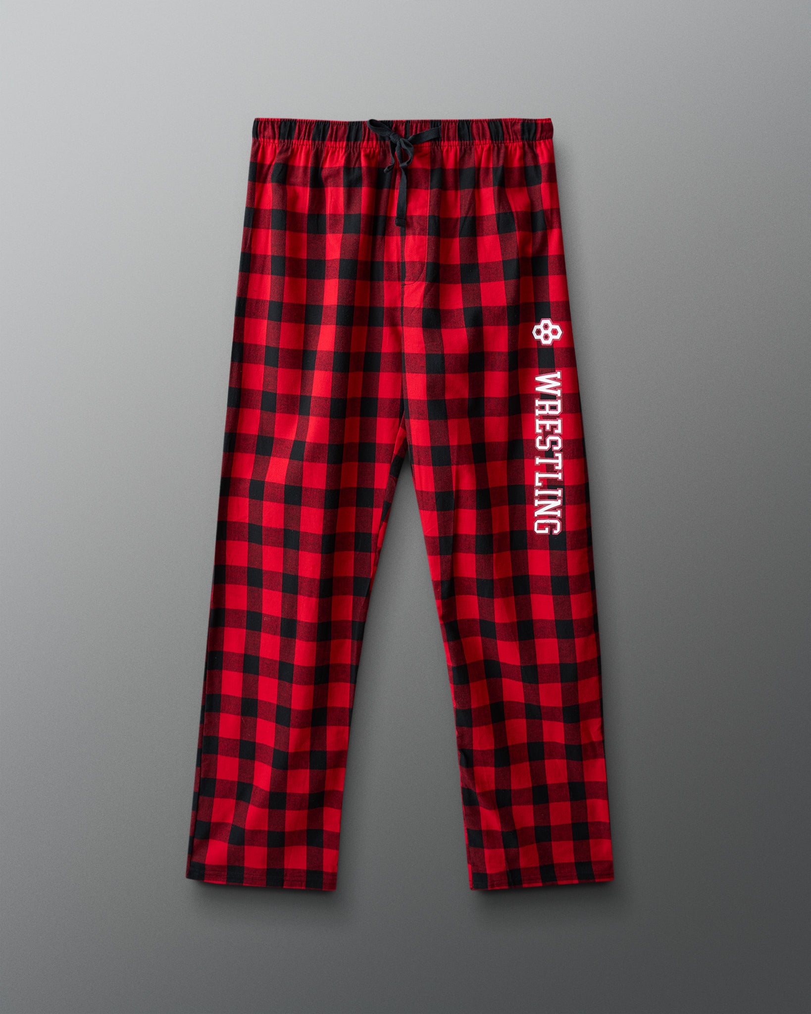Red and black checkered pants with 'Wrestling' text on a gray background