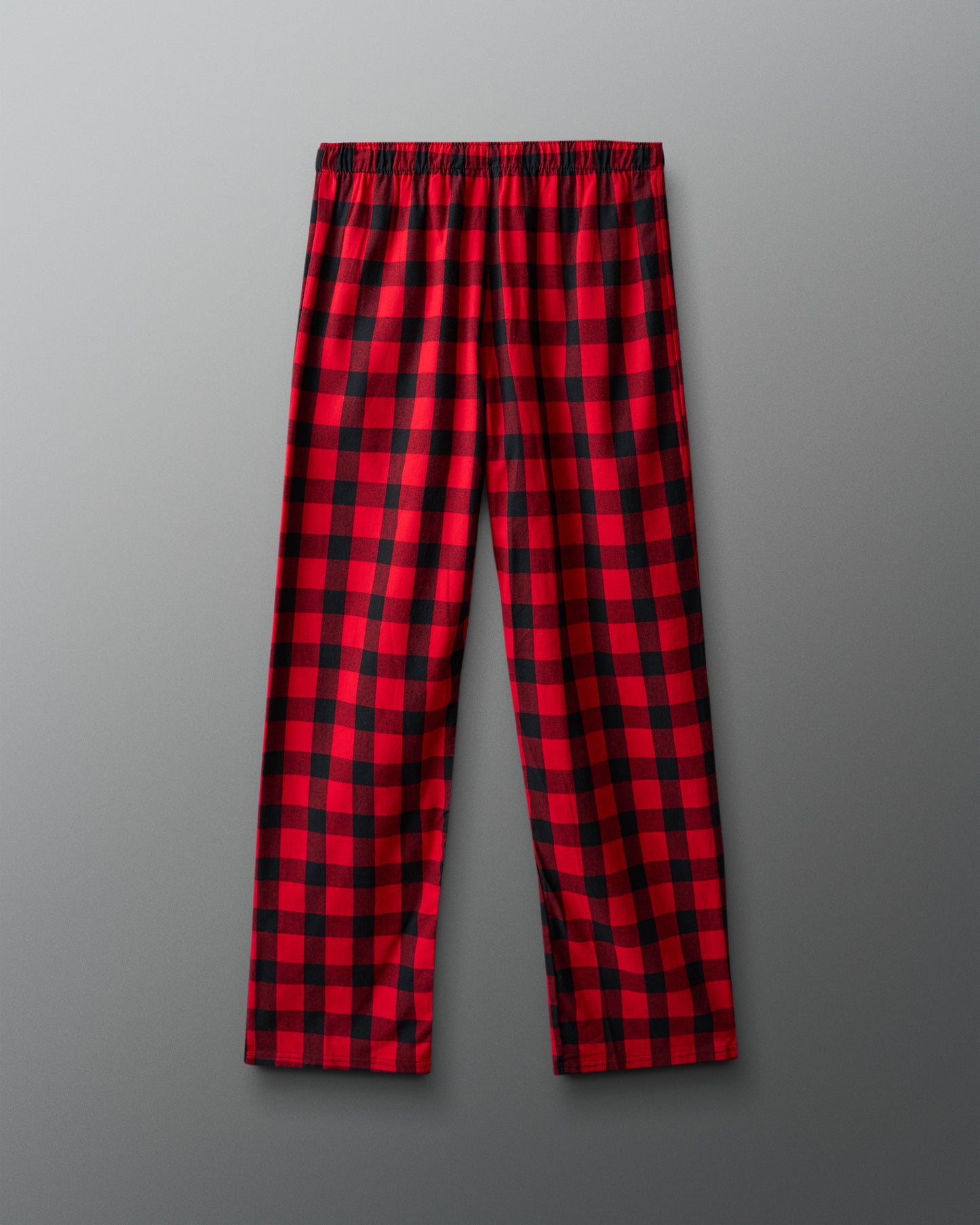 Red and black plaid pants on a gray background
