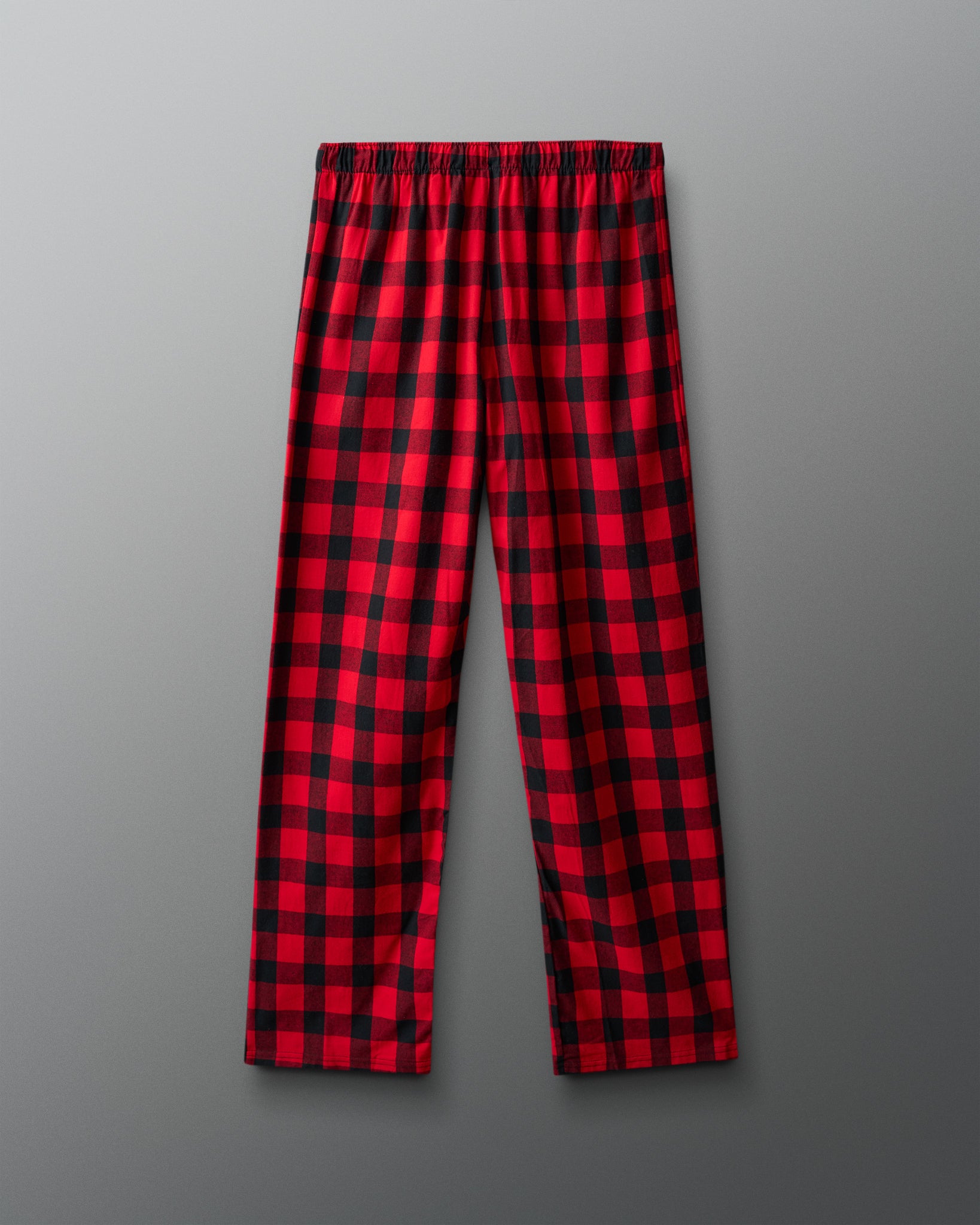 Red and black plaid pants on a gray background
