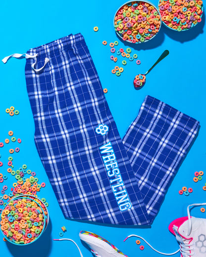 RUDIS Blue plaid wrestling pajama pants with 'wrestling' text on a blue background with colorful cereal.