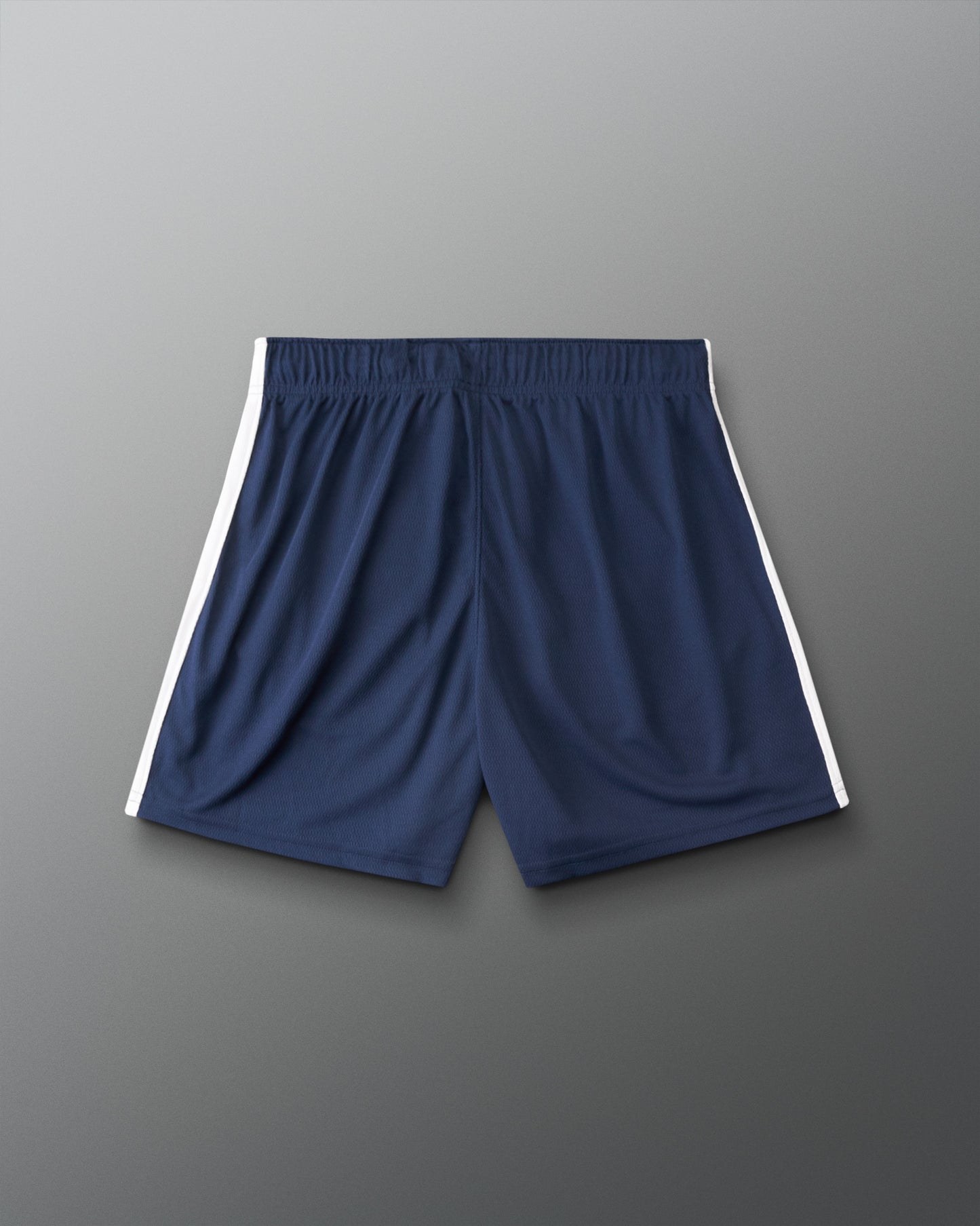 Navy blue athletic shorts with white side stripes, shown flat against a gray gradient background.