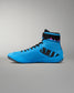 A high-top wrestling shoe in bright blue with black details, including a black patterned side panel, black laces, and a black ankle strap, shown against a neutral gray background.