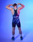 A man wearing a dark blue and black wrestling singlet with purple and teal accents, shown from the back against a blue gradient studio background. The singlet features the text 'Godzilla MONSTER THE New Empire' and a small logo on the back.