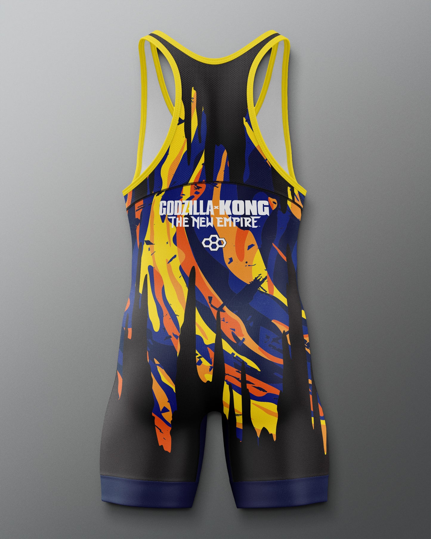 A sleeveless athletic singlet with racerback straps, featuring a black base with a bold blue, yellow, and orange abstract flame-like graphic and 'GODZILLA-KONG THE NEW EMPIRE' text on the chest, shown on a gray gradient background.