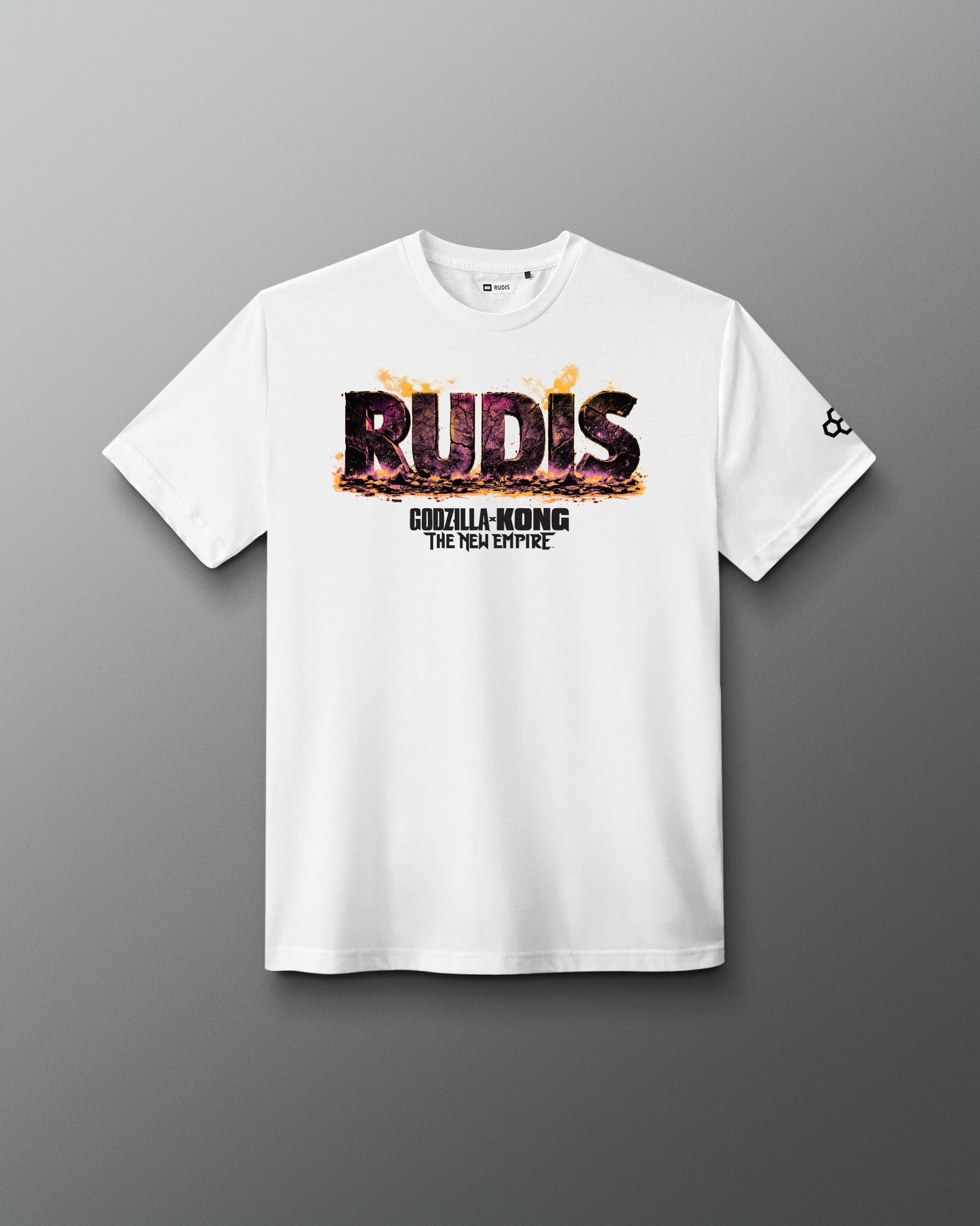A white short-sleeve t-shirt with a 'RUDIS' graphic featuring a Godzilla-Kong flame effect and 'THE NEW EMPIRE' text on the chest, displayed on a dark gray gradient background.