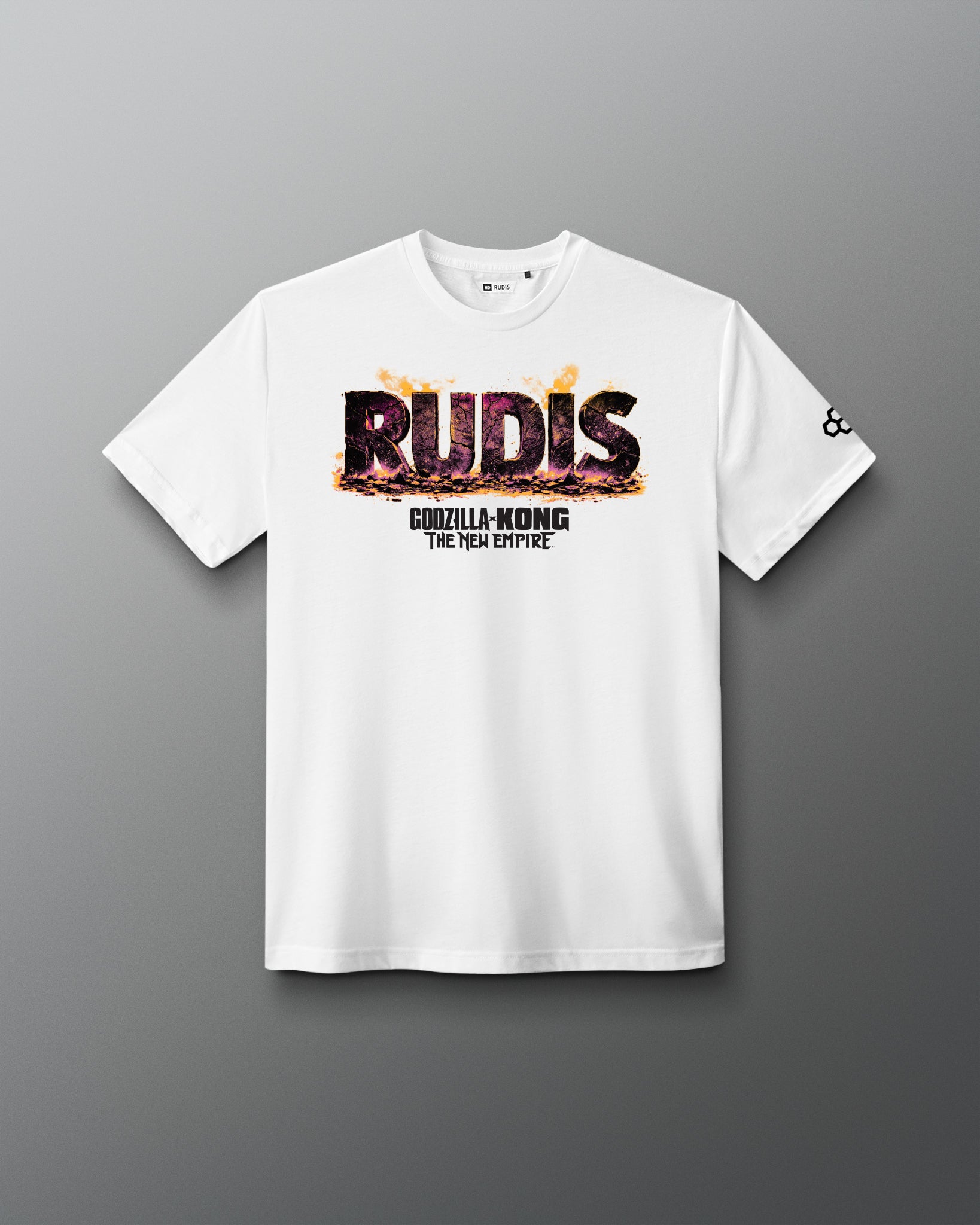 A white short-sleeve t-shirt with a 'RUDIS' graphic featuring a Godzilla-Kong flame effect and 'THE NEW EMPIRE' text on the chest, displayed on a dark gray gradient background.