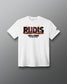 A white short-sleeve t-shirt with a 'RUDIS' graphic featuring a Godzilla-Kong flame effect and 'THE NEW EMPIRE' text on the chest, displayed on a dark gray gradient background.