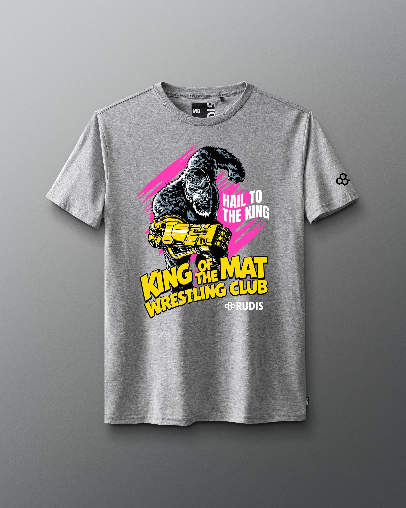 A heather gray short-sleeve t-shirt featuring a bold graphic print of a gorilla holding a gold trident, with the text 'HAIL TO THE KING', 'KING OF THE MAT WRESTLING CLUB', and '@RUDIS' on a gray gradient background.