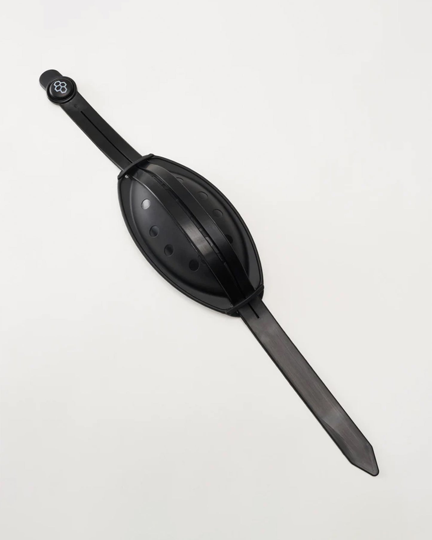 A sleek black chin cup designed for ease of use and functionality featuring an elongated body with a textured grip and a rounded top for easy handling
