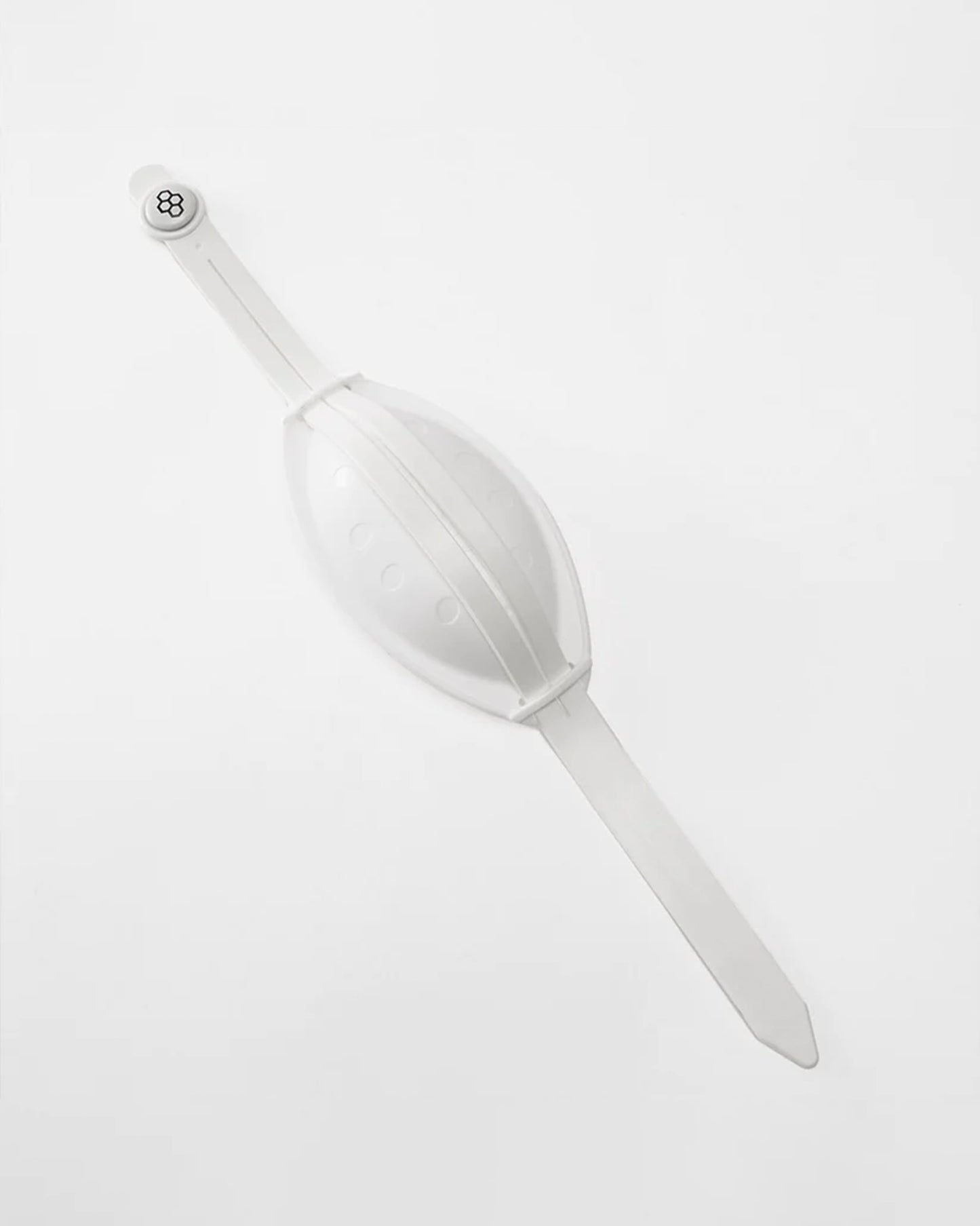 A white chin cup  featuring a smooth oval shape and a snap closure for secure wear and chin protection
