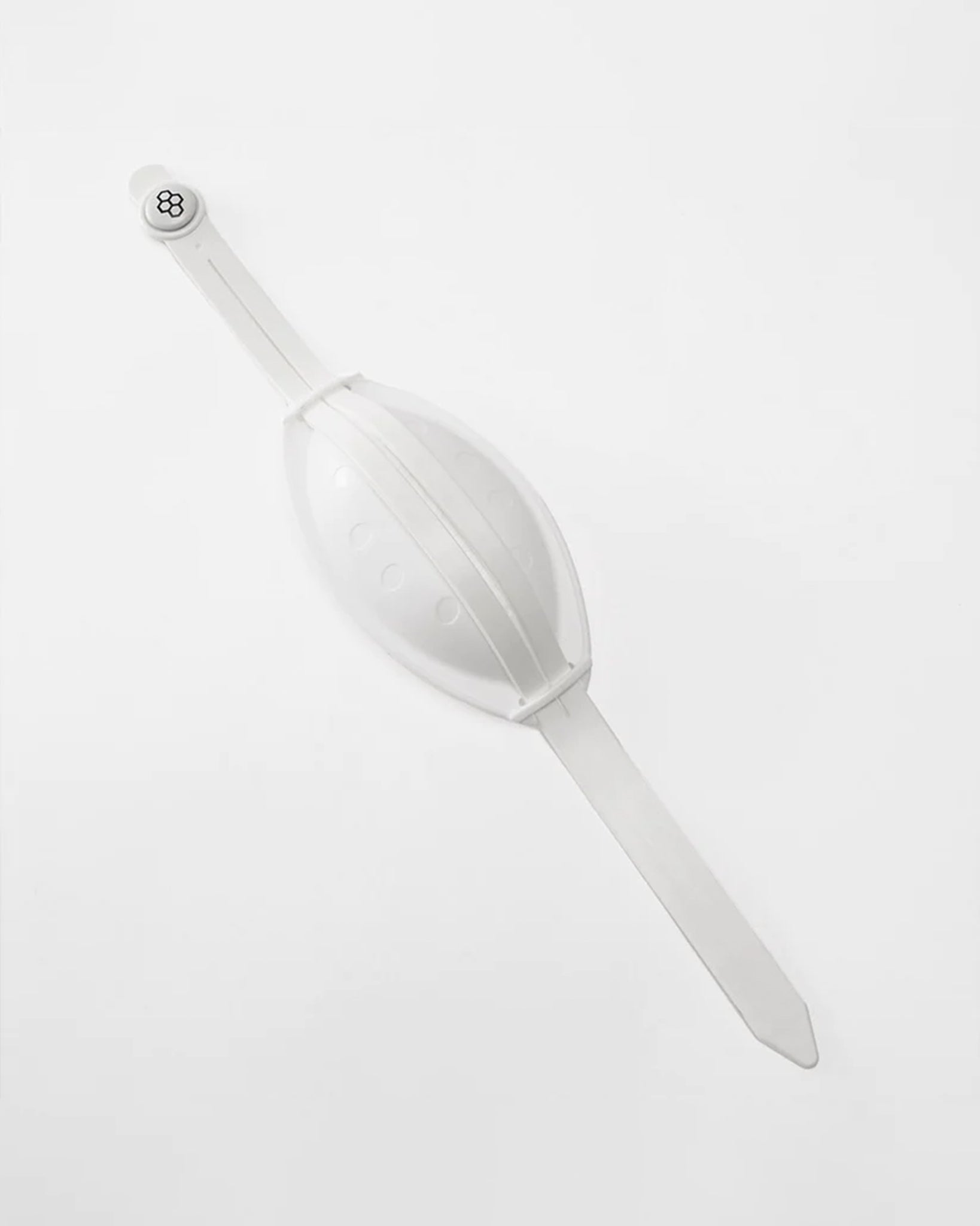 A white chin cup  featuring a smooth oval shape and a snap closure for secure wear and chin protection