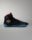 Black wrestling shoe with blue sole on a gray background