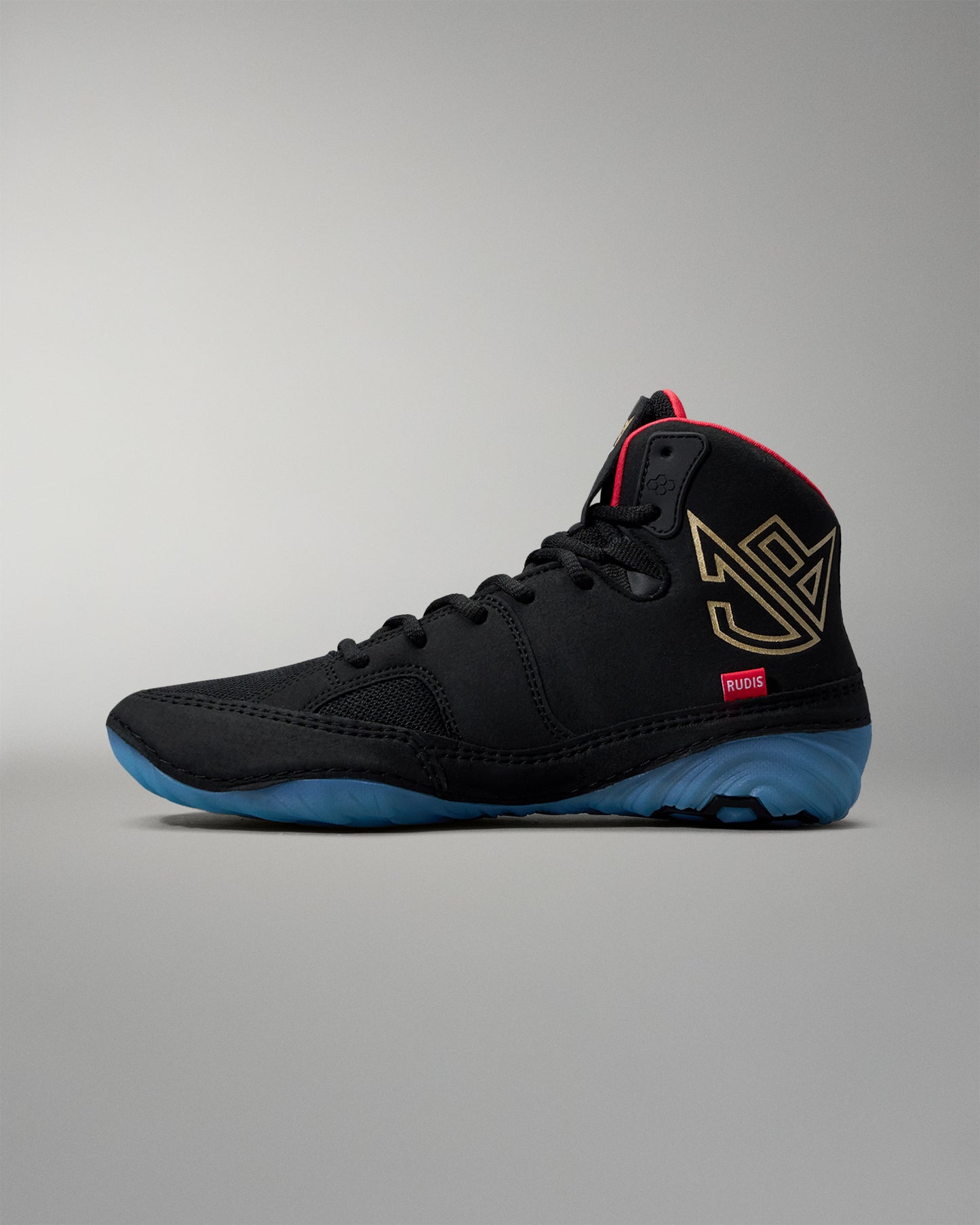 Black wrestling shoe with blue sole on a gray background