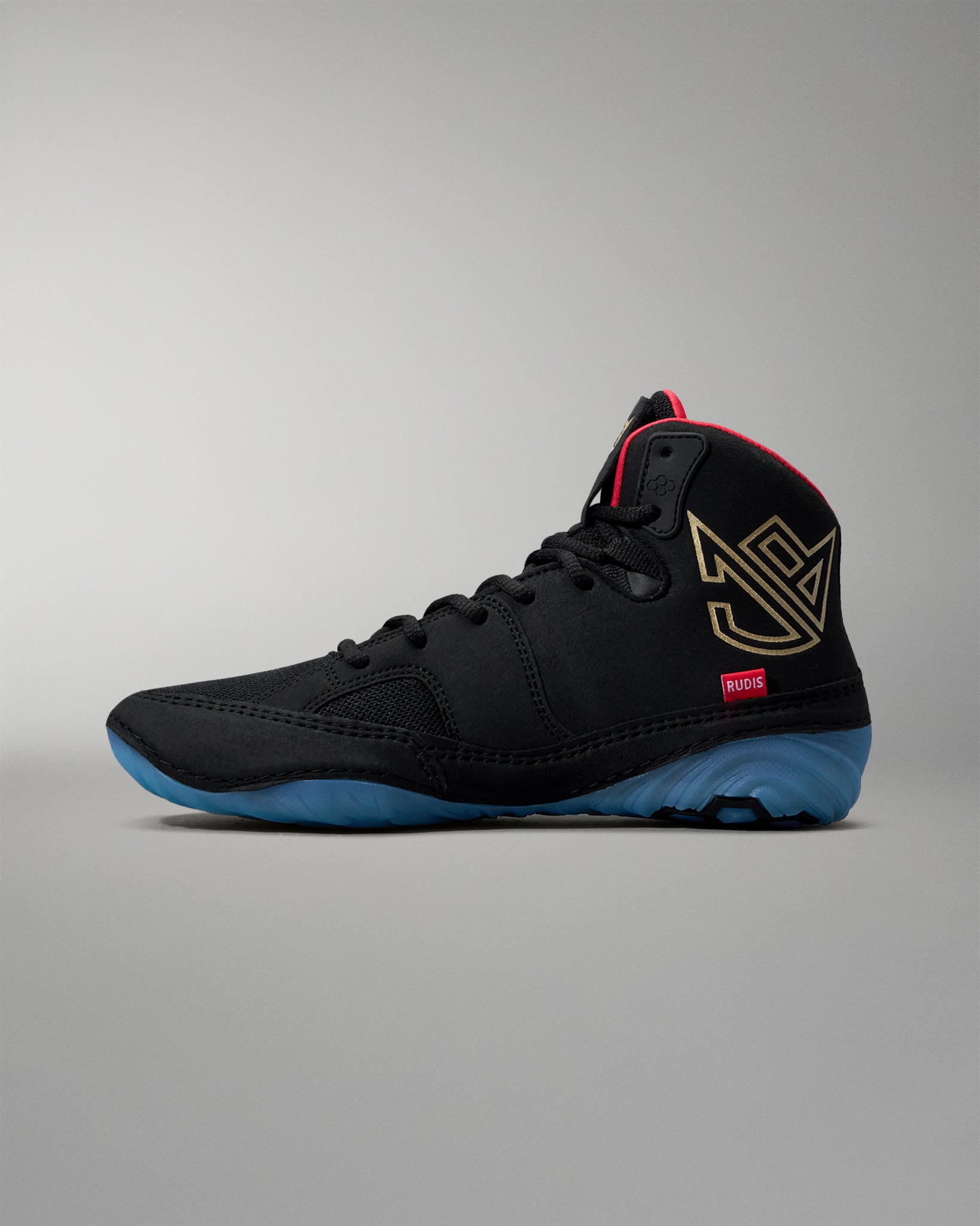 Black wrestling shoe with blue sole on a gray background