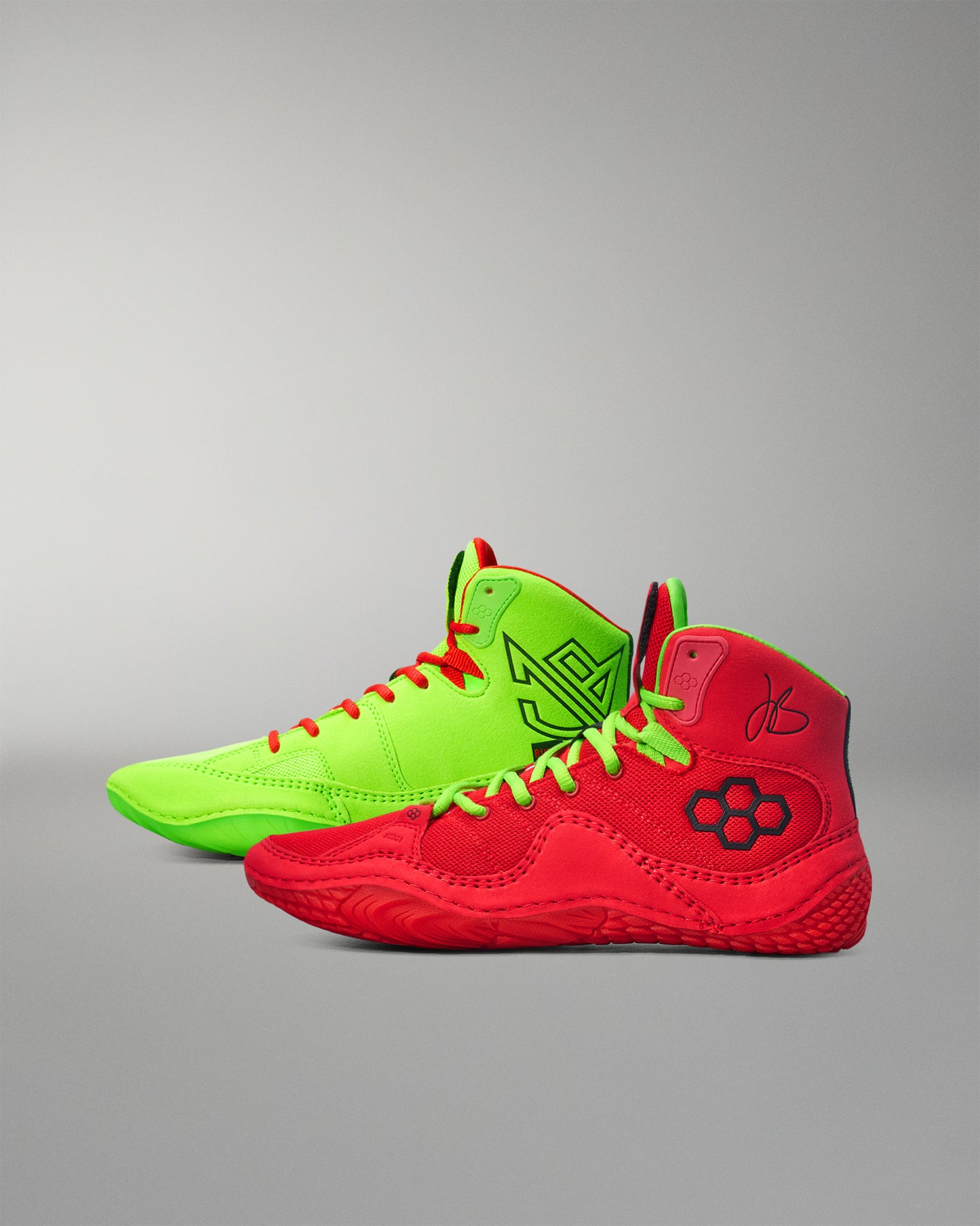Red and green Wrestling shoes on a gray background