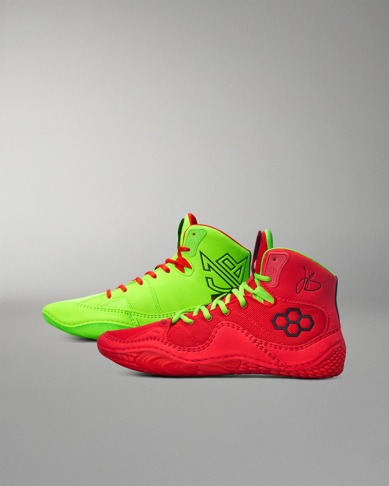 Red and green Wrestling shoes on a gray background