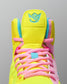 Brightly colored Wrestling shoe with pink laces on a gray background