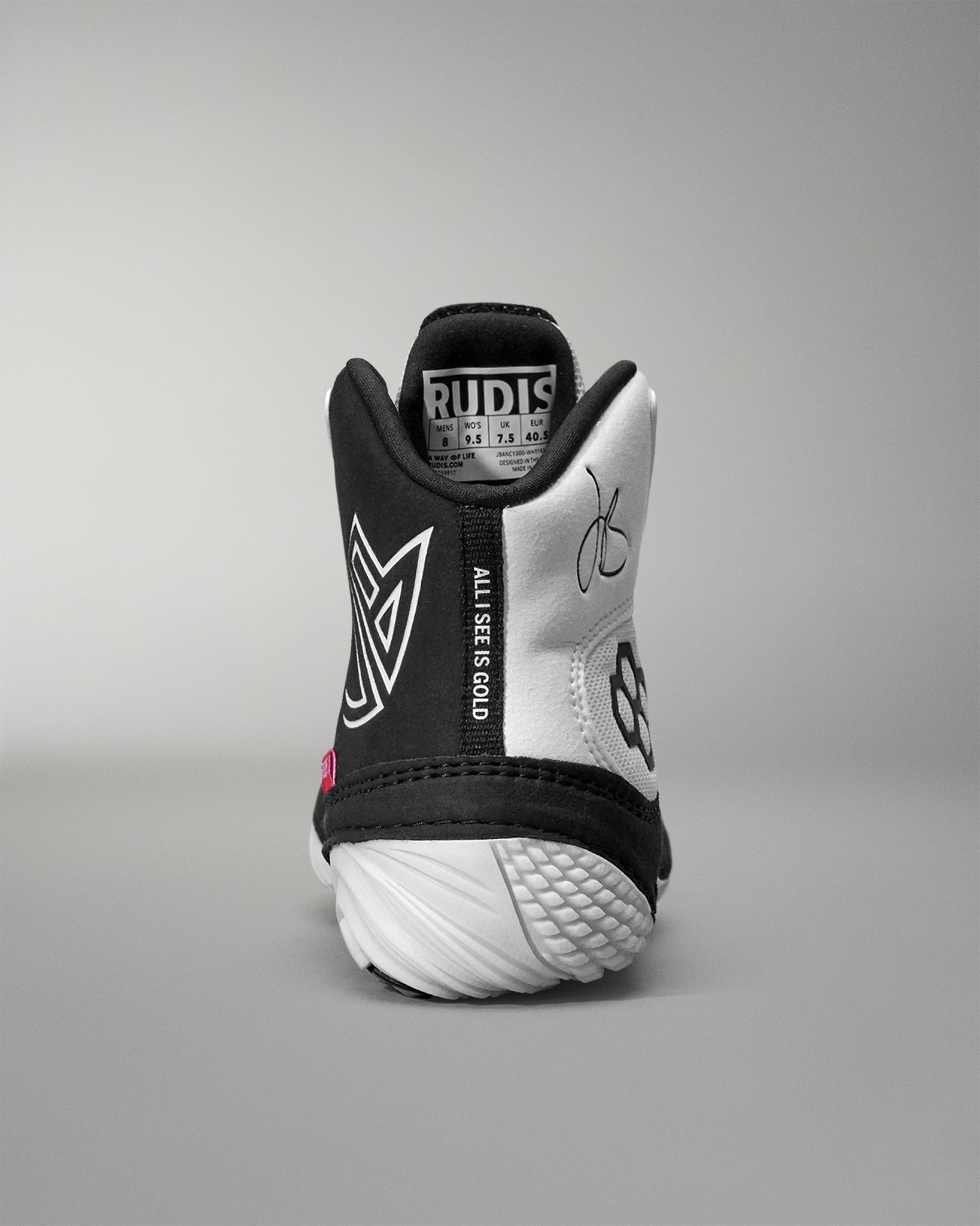 Black and white Jordan Burroughs Wrestling shoes with visible branding on a gray background