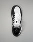 Black and white Jordan Burroughs Wrestling shoes on a gray background