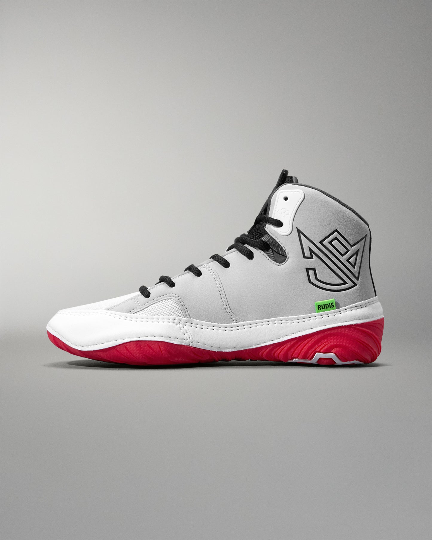 White wrestling shoe with red soles on a gray background