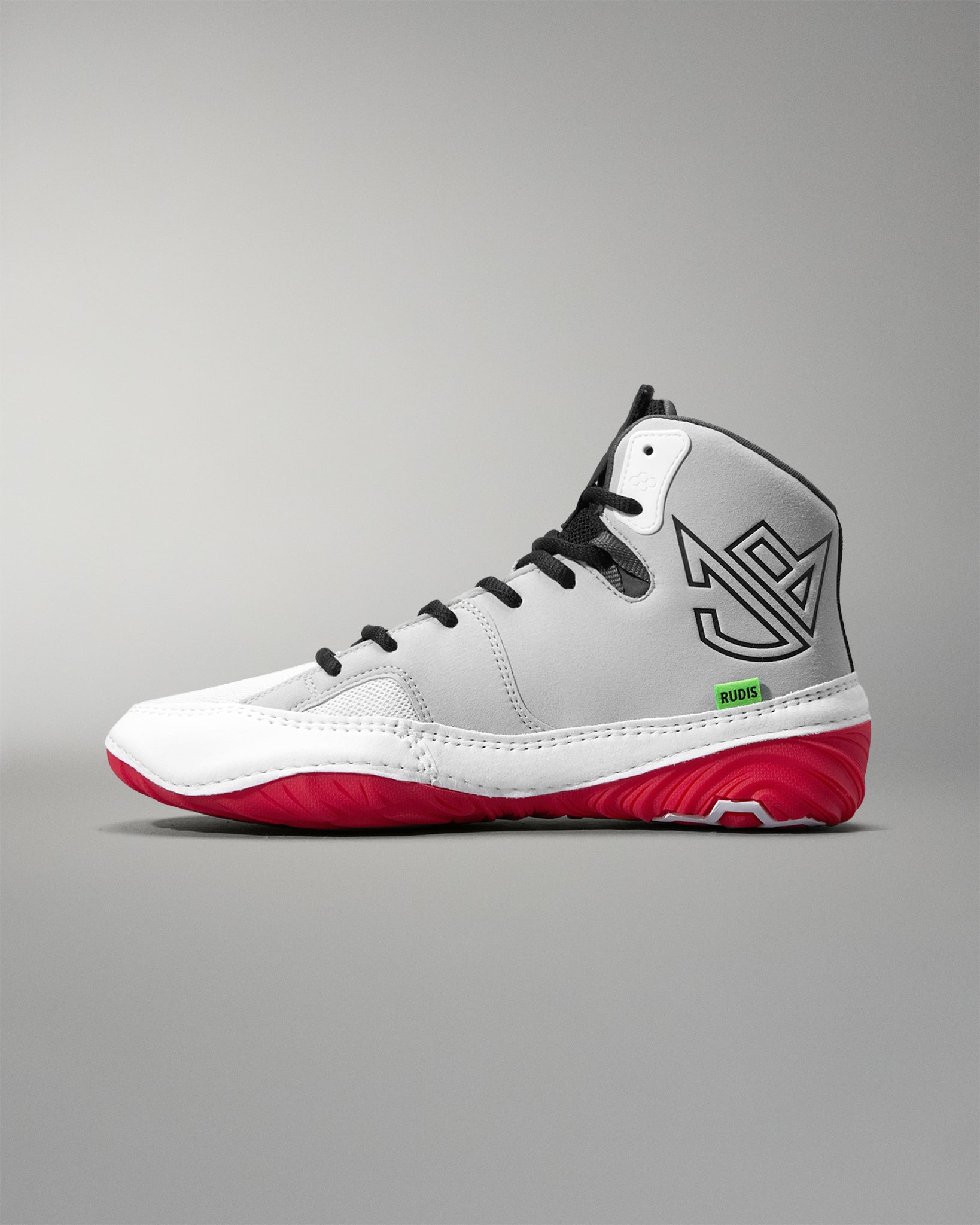 White wrestling shoe with red soles on a gray background