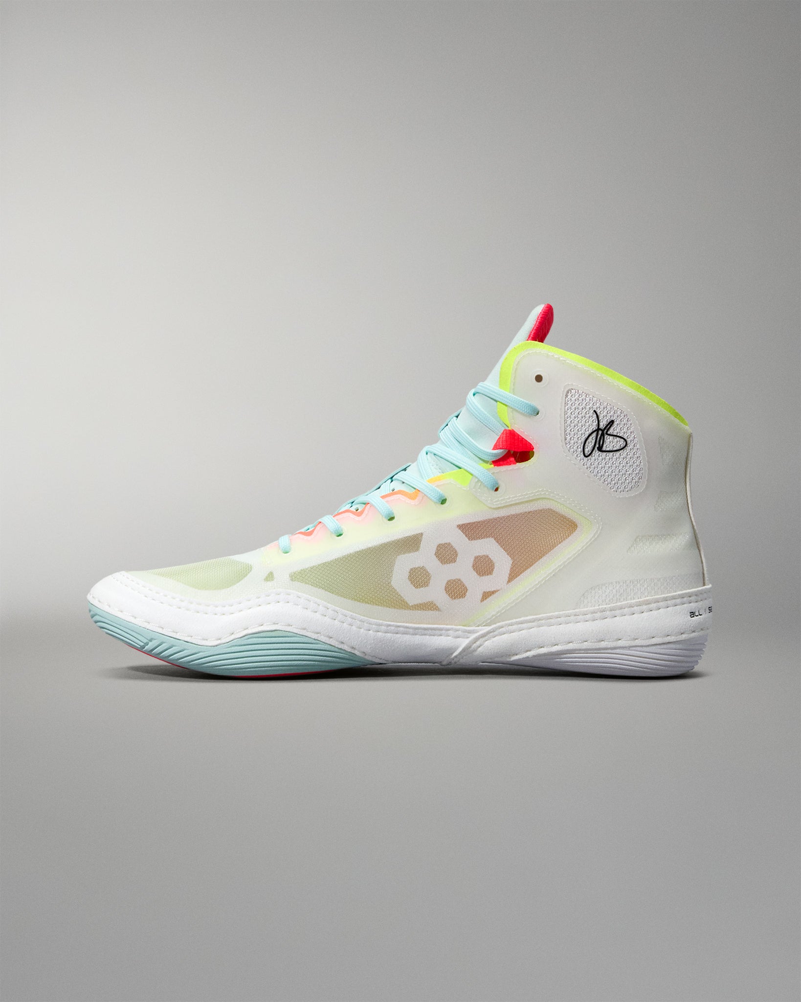 Side view wrestling  shoe with colorful laces on a gray background