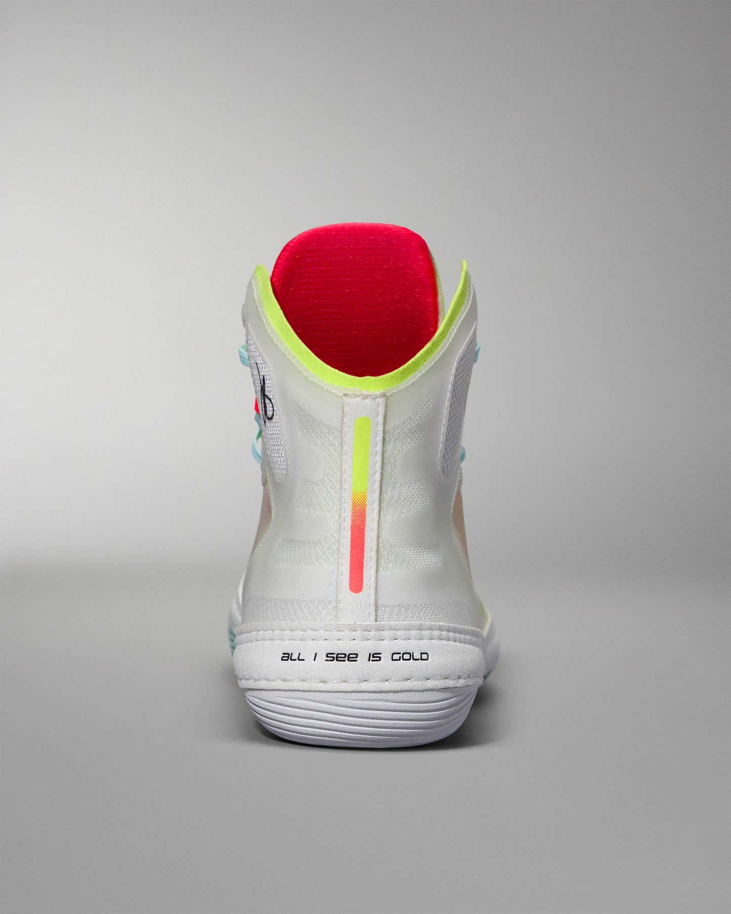 Back view White  wrestling shoe with colorful sole on a gray background