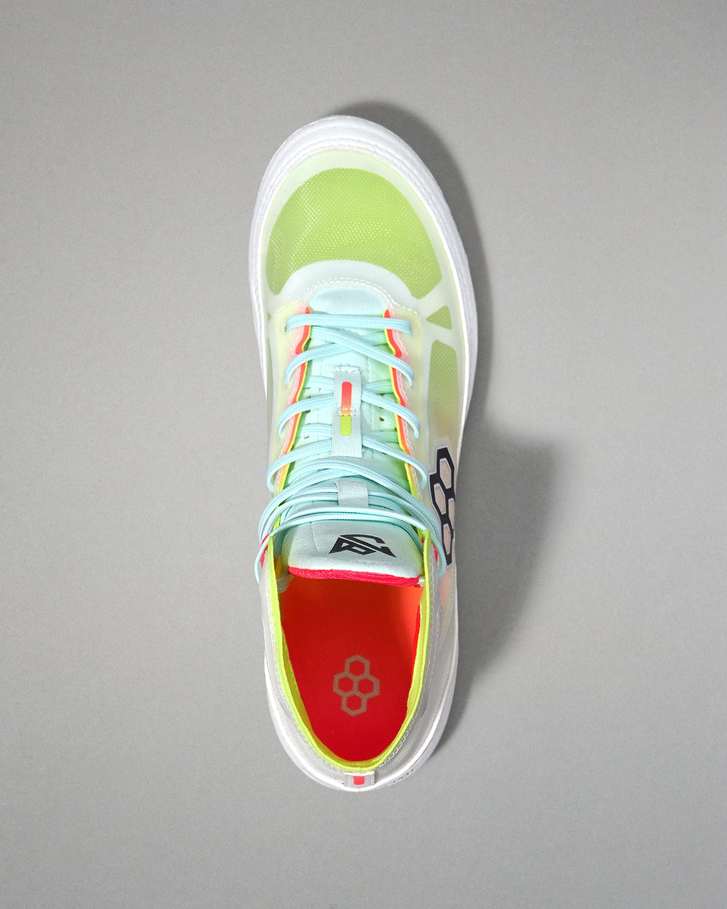 Top view of  wrestling shoe  with a red sole on a gray background